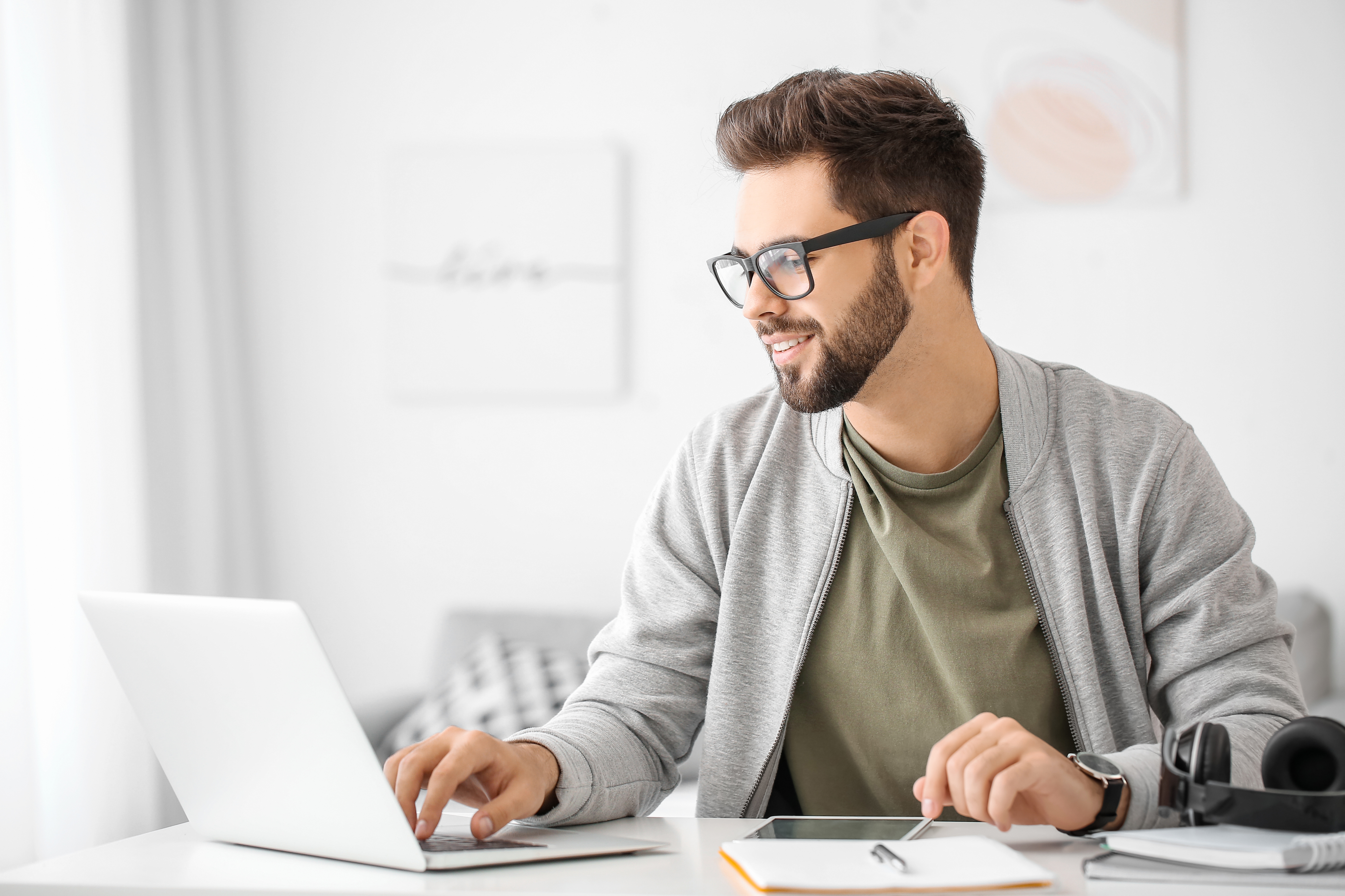 A man with his laptop writing an exam