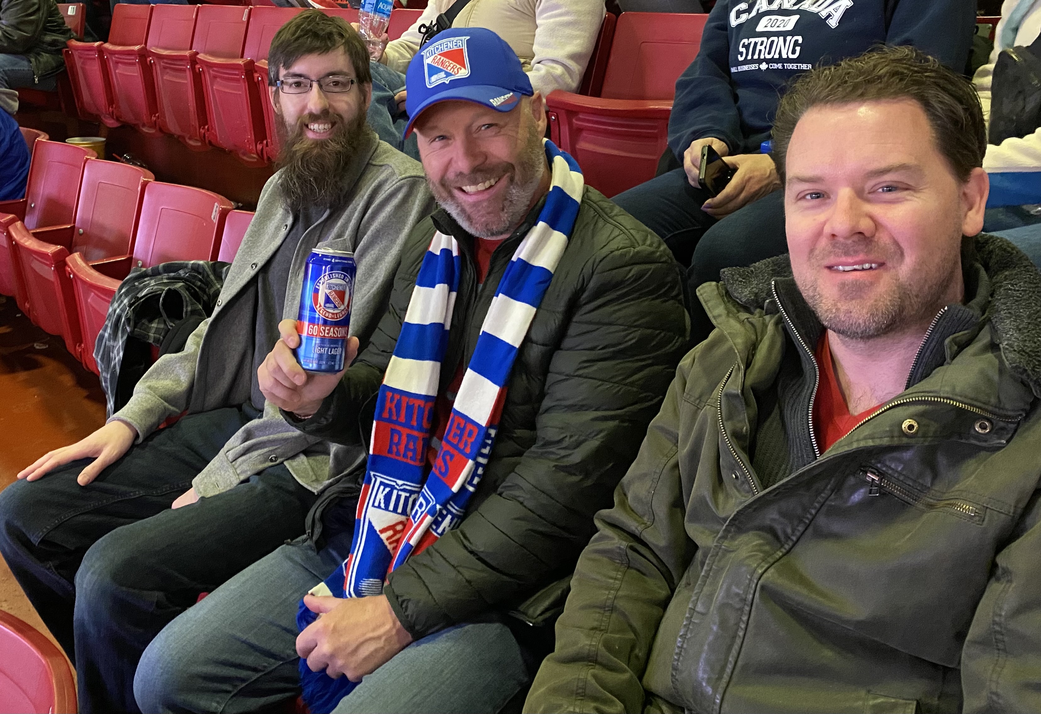 hockey 2 men sitting in bleachers