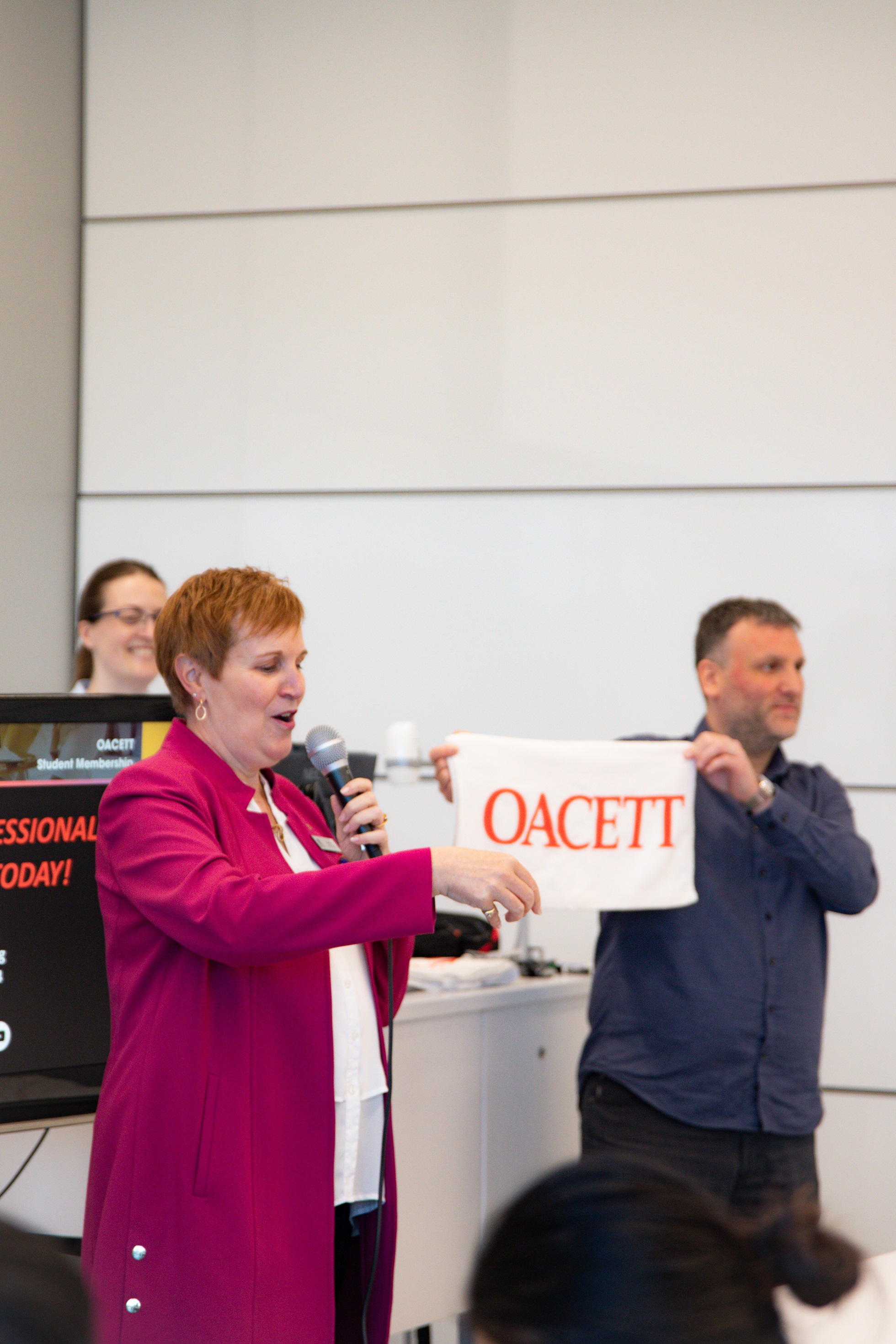 5 Woman holding OACETT banner